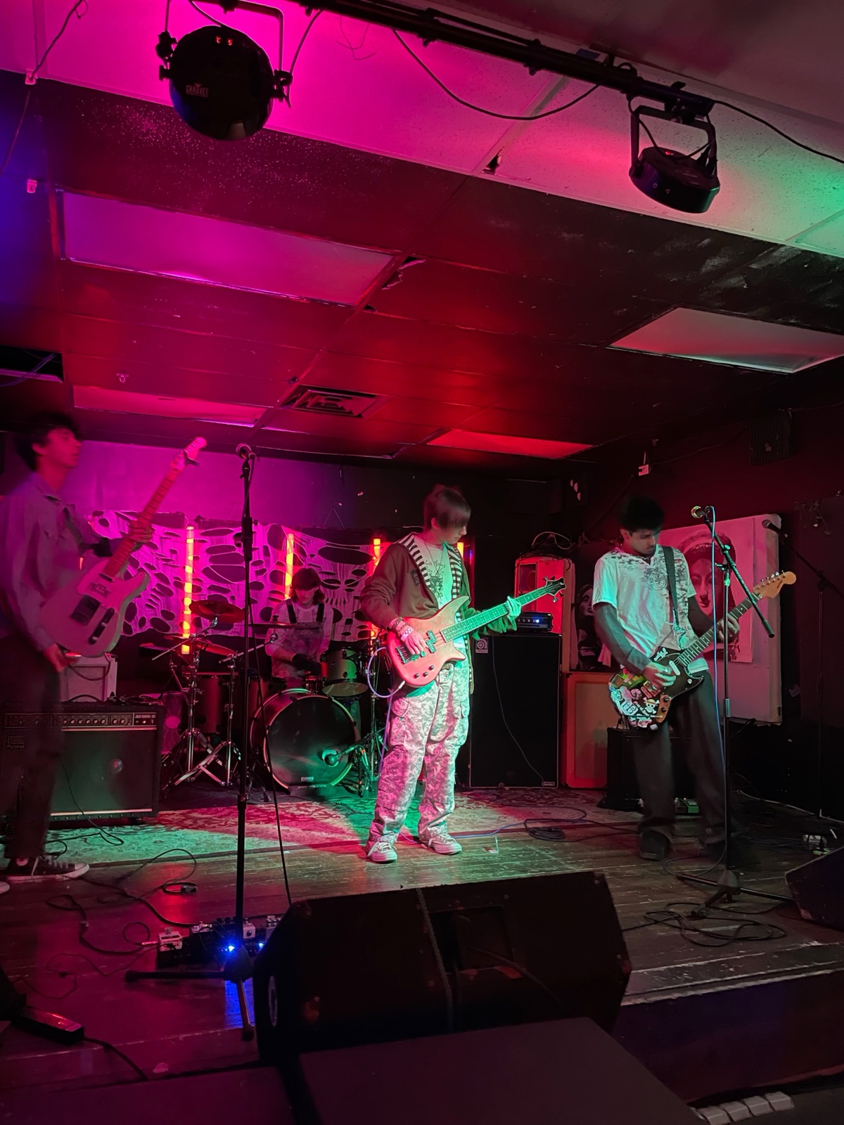 Blank Stare playing on Healer's stage, three guitarists across the front and the drummer behind.